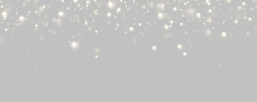 Clusters of soft golden bokeh lights float against a dark background. The glowing orbs vary in size and intensity, creating a delicate shimmering effect.