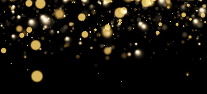 Soft bokeh orbs float in a dark space creating a scattered light effect. The glowing circles vary in gold and white hues with different sizes and diffusion levels.