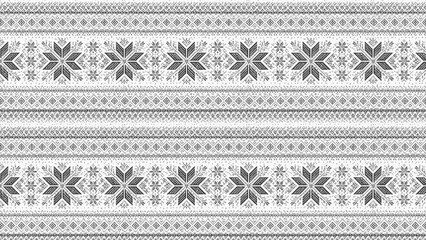 Traditional nordic knitted pattern featuring intricate snowflakes and geometric diamond shapes rendered in classic dark grey and soft white colors © Harsh