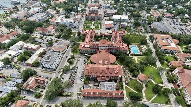 Aerial view of the historic Lightner Museum with its distinctive red tile roofs, courtyard, and swimming pool in St. Augustine, Florida, United States.