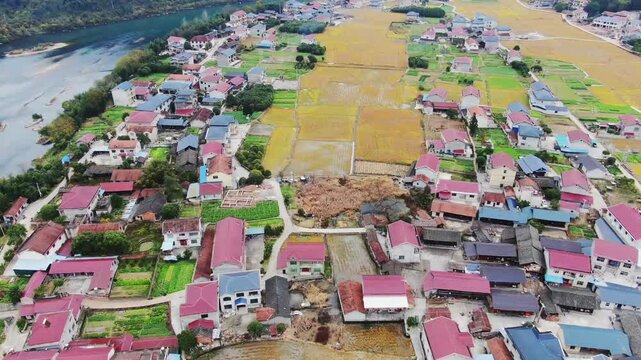 Aerial View of Riverside Village and Farmland in Rural China
