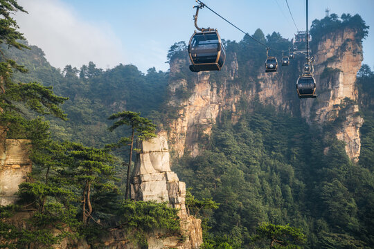 Tourists ride cable cars through Zhangjiajie National Forest Park to see the scenic sandstone peaks