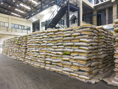 Aerial view of Lagos Rice Mill with massive stacks of rice bags stored in a large industrial warehouse in Imota, Lagos, Nigeria.