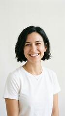 Fototapeta premium Smiling Woman with Short Dark Hair Wearing White T-Shirt.