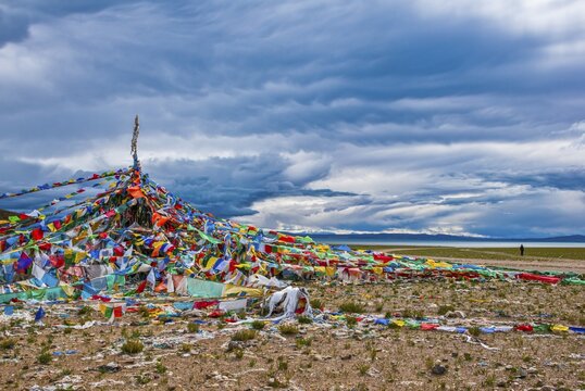 Praying flags with view on the Manarasowar lake, along the southern route into Western Tibet, Asia