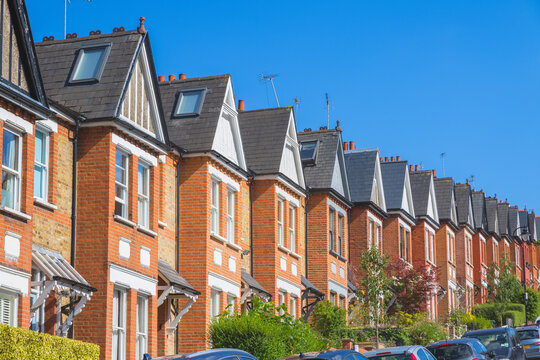 Row of identical English terraced houses in Crouch End, North London, UK
