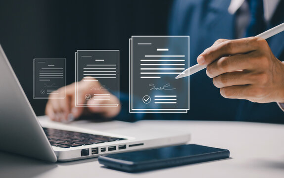 Business professional using digital pen with virtual electronic documents and signatures, illustrating e-signature, online contract approval, paperless workflow and document management.