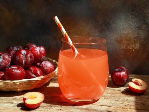 Fresh cherry plum juice in glass, refreshment drinks.