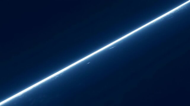 Glowing diagonal light streak moves across a dark blue abstract field with atmospheric particles. Technology presentation, digital title sequence, and corporate innovation media.