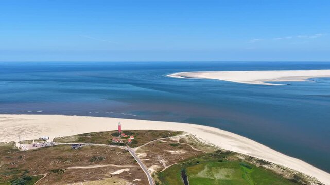 Aerial view of a lighthouse on the island Texel with Vlieland in the distance