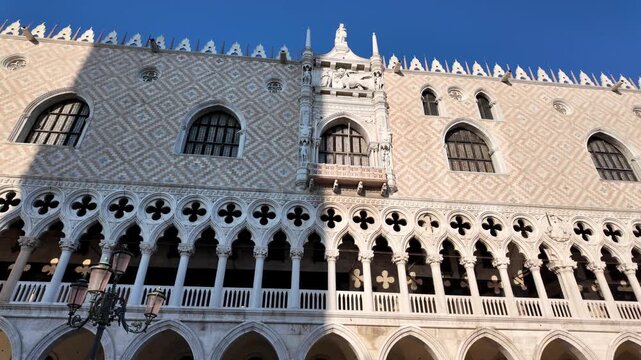 Historic architecture in Piazza San Marco, Venice, showing the decorated facade of Doge&rsquo;s Palace with its distinctive Gothic design