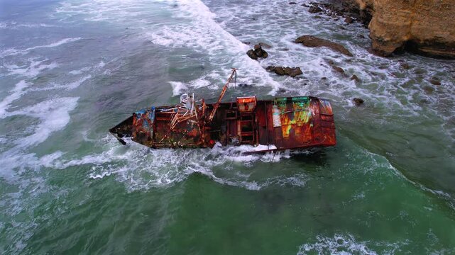 Waves breaking through the rusted VICMAR shipwreck off the Baja California coast between Tijuana and Ensenada, Mexico