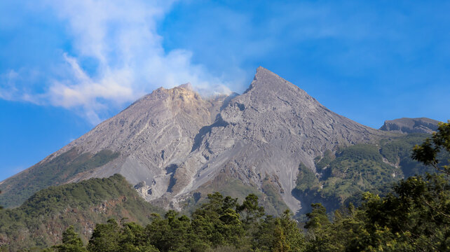 Beautiful morning landscape of Mount Merapi in Sleman, Yogyakarta, Indonesia, featuring a scenic mountain view, fresh atmosphere, natural surroundings, and peaceful countryside scenery.