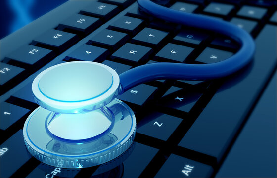 Medical stethoscope resting on a computer keyboard representing digital health and telemedicine technology.