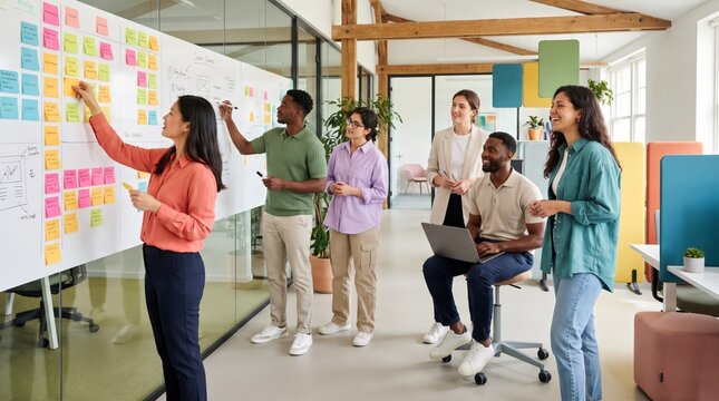 Team brainstorming session with sticky notes on an office whiteboard
