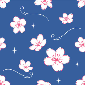 Elegant seamless cherry blossom pattern featuring white and pink sakura flowers, graceful flowing curved lines and sparkling stars on a deep blue background in hand drawn vector style.