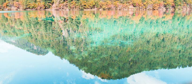 Scenery Jiuzhaigou national park in Sichuan, China. Beautiful of Mirror Lake in Autumn season. Famous Landmark and Vacation near Chengdu, China. Asia travel concept