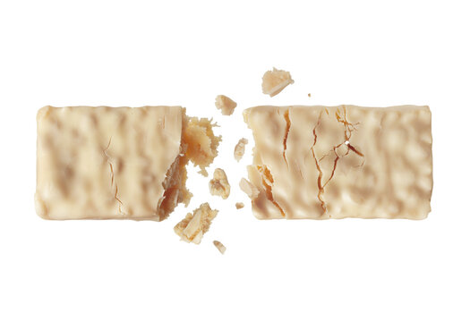 White energy bar broken into two halves in the air close-up isolated on transparent background