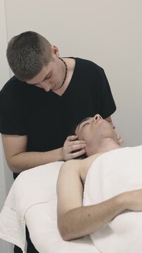Professional physical therapist performing neck massage