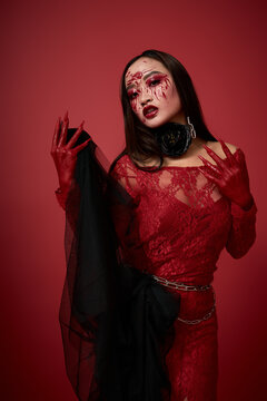 Dark asian queen haunting the night with blood and beauty for Halloween