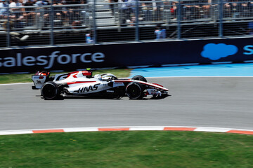 Fototapeta premium May 24, 2026, Montreal, Canada, Esteban Ocon races a Haas F1 car at Circuit Gilles-Villeneuve. g