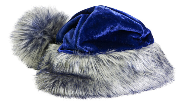 Isolated luxurious blue velvet and faux fur winter hat with pompom, elegant seasonal accessory