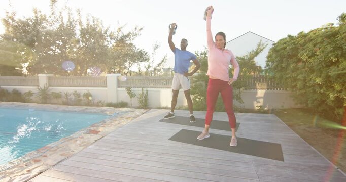 Lifestyle videos outdoor of people doing activities, exercising outdoors, man and woman lifting kett