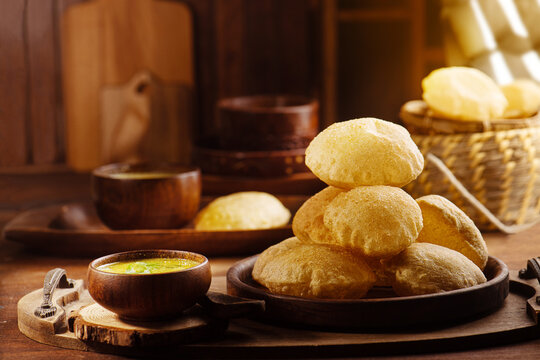 Traditional Indian food puri masala served in wooden plate