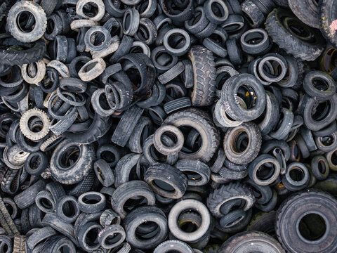 Aerial view of a large pile of discarded used rubber tires stacked in a messy heap, Latvia.