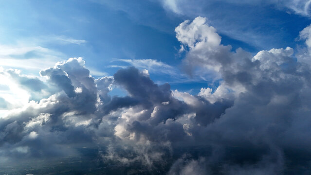 Aerial view of dramatic clouds and blue sky over the landscape of Sukabumi Regency, West Java, Indonesia.