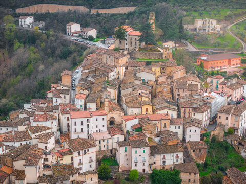 Aerial view of the historic hilltop town of Anversa degli Abruzzi, featuring dense stone architecture and terracotta rooftops nestled in the mountains of Anversa degli Abruzzi, Abruzzo, Italy.