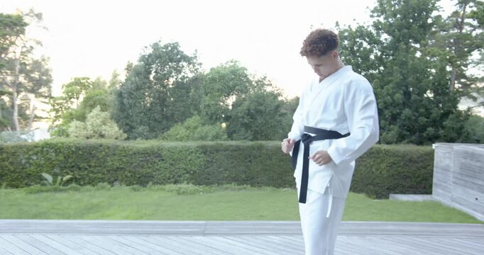 Lifestyle videos outdoor of people doing activities , practicing martial arts, person in karate unif