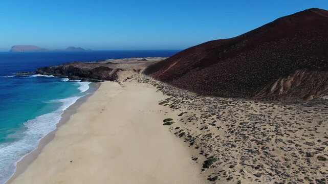 Drone shot of Las Conchas Beach on the beautiful Canary Island of La Graciosa.