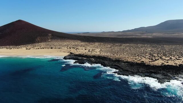 Drone shot heading towards La Concha Beach on the nice Canary Island of La Graciosa.