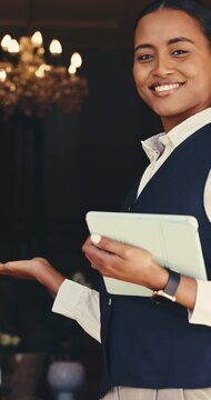 Concierge, tablet and welcome with happy woman in hotel for agenda, booking schedule or planning. App, reservation and smile with friendly hostess in dark lodge for management of guest calendar