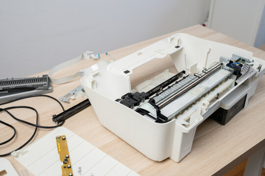 Disassembled Printer On Desk Being Repaired - Technician Working On Office Scanner Hardware