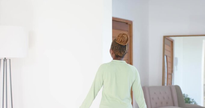 High-speed photography for dynamic scenes, woman standing indoors with neutral expression, wearing g