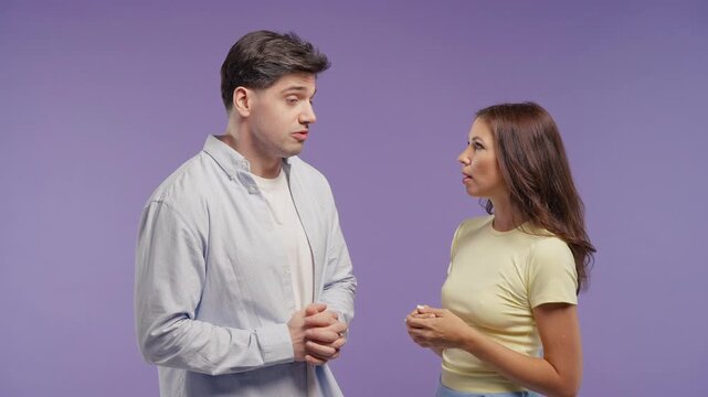 Adult man and woman friends nice talking together, small talk. Friends or young couple smiles, share news, information