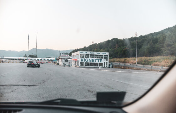 KULATA, BULGARIA &ndash; AUGUST 15, 2026: Vignette sales point near the Bulgaria-Greece border crossing in Kulata, with a duty-free shop and vehicles visible nearby.