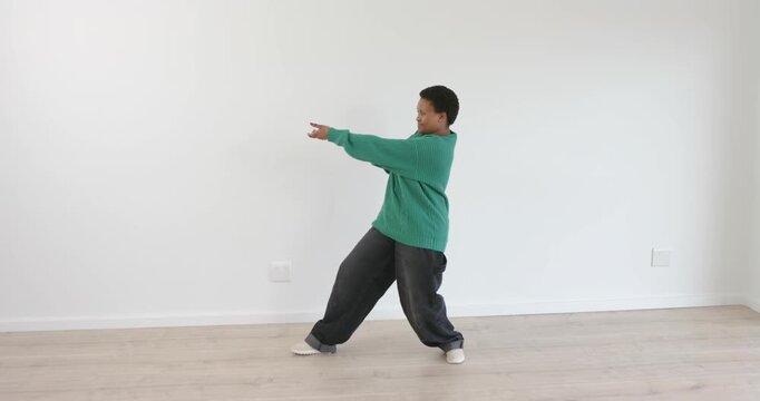 High-speed photography for dynamic scenes, dancing joyfully, person in green sweater pulling