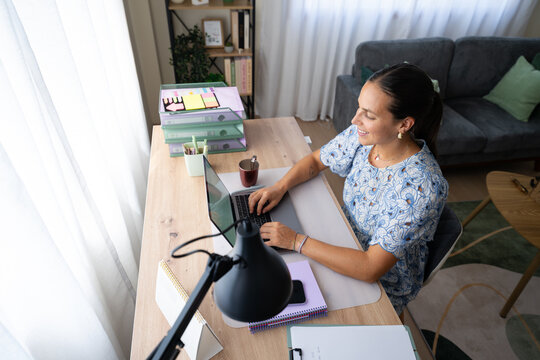 White woman working on laptop