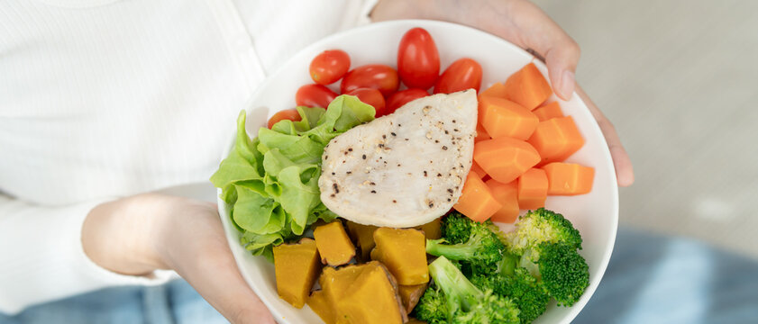 healthy food. Beautiful female girl smiling enjoy eat fresh vegetable salad on breakfast health. Happy asian woman good emotion. dieting, detox, diet, lose weight, clean eat, vegetarian, nutritionist