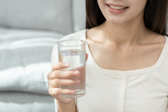 slim body asian women choose drink for good skin, dieting female choose water for diet. Good healthy food. weight lose, balance, control, reduce fat, low calories, routines, exercise, body shape.