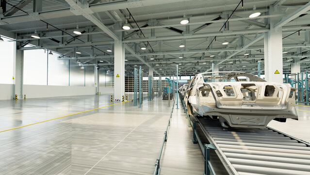 Car frames on assembly line in modern manufacturing plant