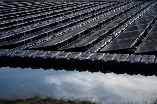 Solar cells in solar farms on surface mounting management on water, alternative energy and sustainable energy, pure energy, renewable, clean energy, reduce global warming, environment, green energy