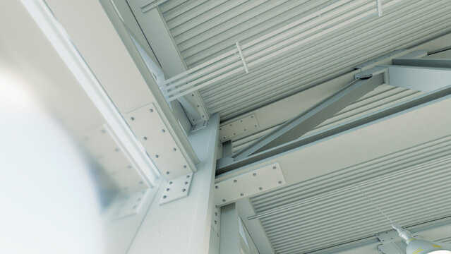 Industrial warehouse ceiling with metal beam framework
