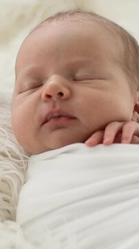 Newborn Baby Sleeping In A Wrap In A Vertical Video
