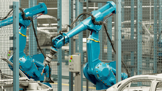 Robotic arms assembling car frames in manufacturing plant