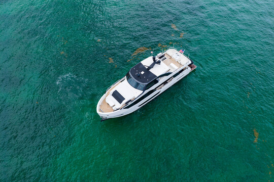 Yacht boat tour. Luxury boat yachting. Motorboat sailing at sea. Luxury charter yacht in sea. Motor yacht luxury vessel. Sea motor boat. Sea summer vacation. Aerial motorboat