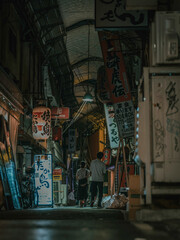 Fototapeta premium 夜の商店街,阪和商店街/Night market street scene with neon signs and lanterns